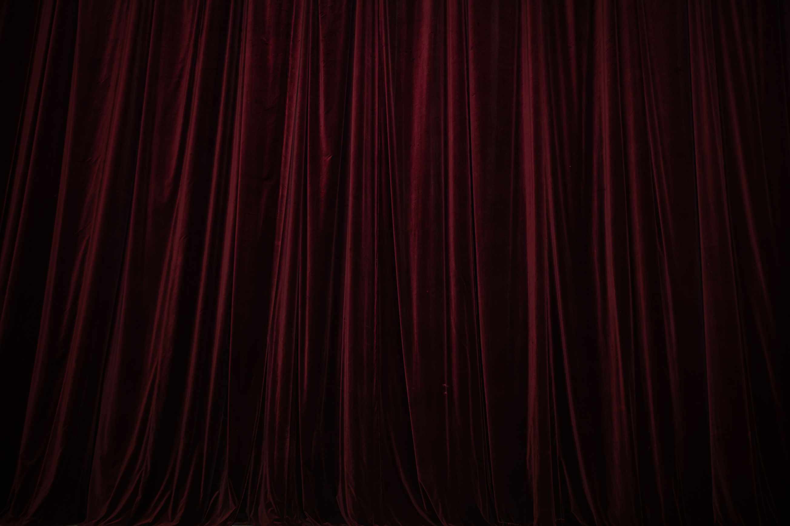 Red Velvet Curtain on Dark Background